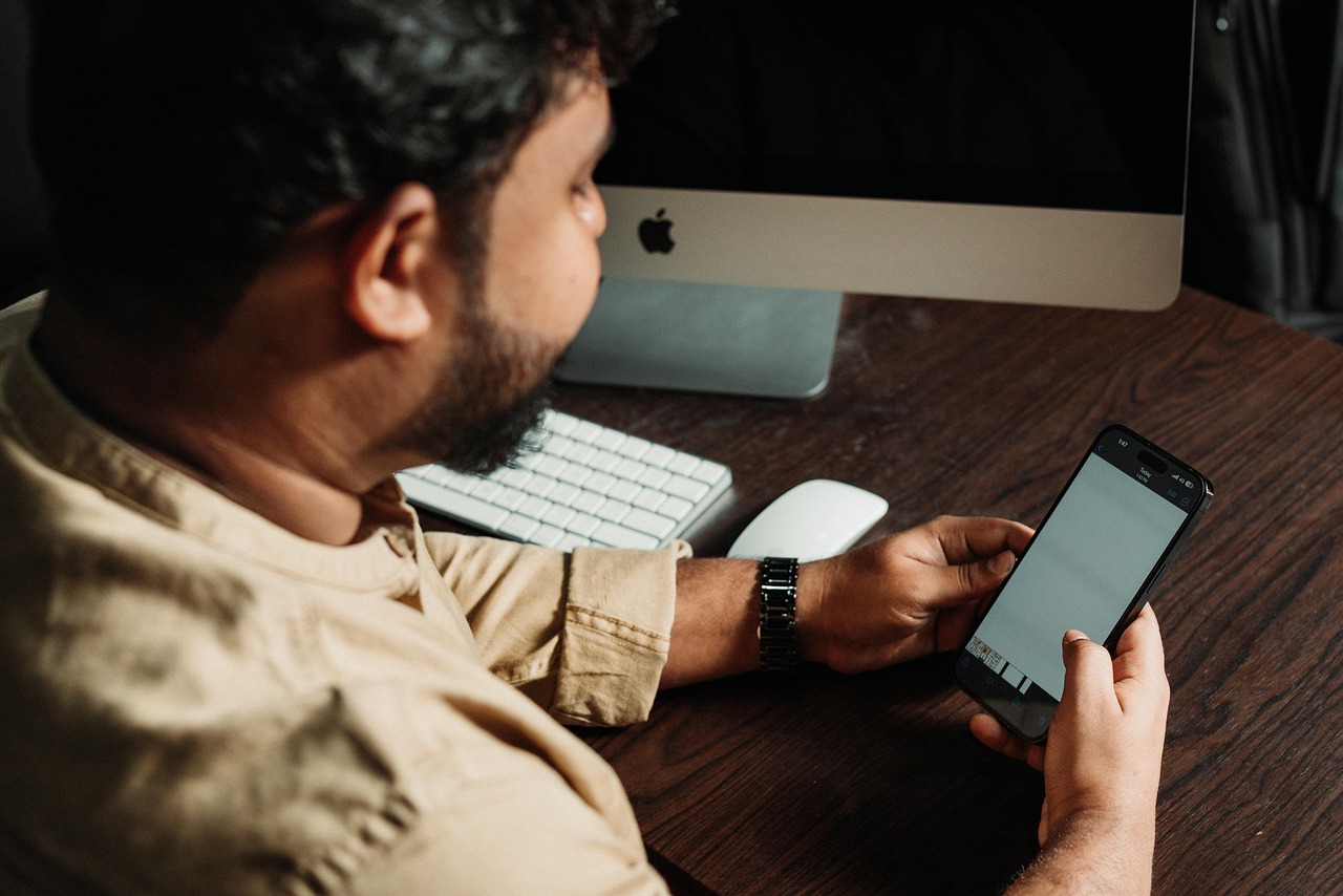 Man, smartphone, social media — Do Backlink Services Really Work? Analyzing Their Impact On Seo